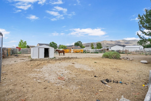 4212 N Majors St E, Eagle Mountain, UT 84005 - view of yard with a mountain view and a storage unit