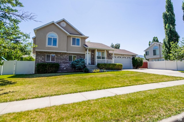 1536 N 150 W, Bountiful, UT 84010 - tri-level home with an attached garage, concrete driveway, brick siding, stucco siding, and a gate