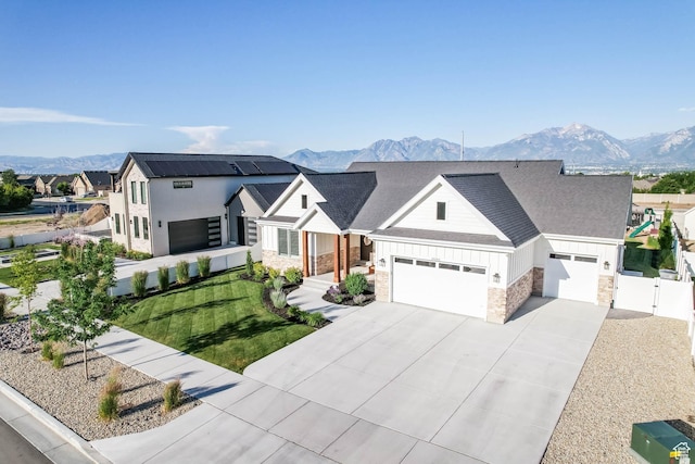 10243 S Dial Ct, South Jordan, UT 84009 - modern farmhouse style home featuring an attached garage, a mountain view, driveway, and a gate