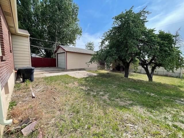 1783 N 300 W, Sunset, UT 84015 - view of yard with a garage, concrete driveway, and an outdoor structure
