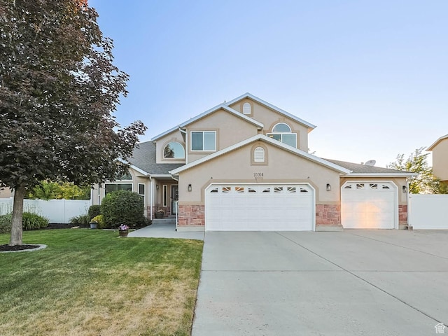 10314 S 3970 W, South Jordan, UT 84009 - traditional-style home featuring concrete driveway, stone siding, stucco siding, and a garage