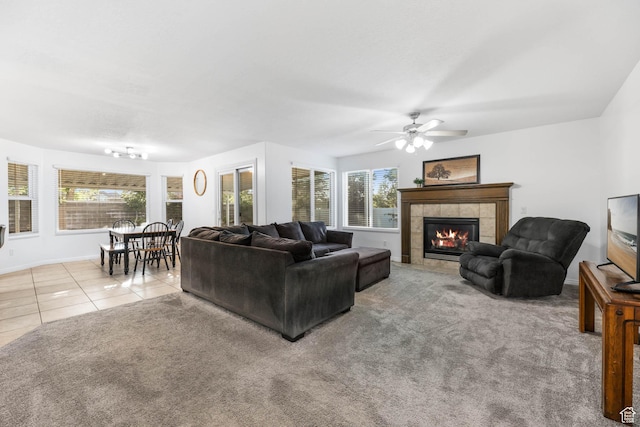 10314 S 3970 W, South Jordan, UT 84009 - carpeted living room with plenty of natural light, a tile fireplace, a ceiling fan, and tile patterned flooring