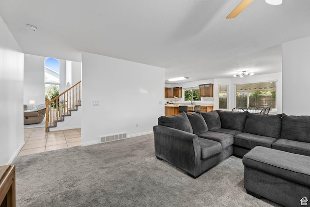 10314 S 3970 W, South Jordan, UT 84009 - living room with stairway, light carpet, ceiling fan, and light tile patterned floors
