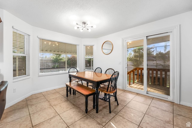 10314 S 3970 W, South Jordan, UT 84009 - dining area featuring light tile patterned floors, a chandelier, and a textured ceiling