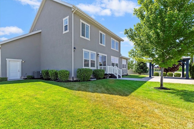 12140 S Galena Grove Way W, Draper, UT 84020 - rear view of property with stucco siding and a yard