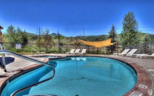 6785 N 2200 W Unit 207, Park City, UT 84098 - view of pool with a patio area and a pool with connected hot tub