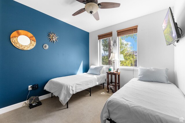 6785 N 2200 W Unit 207, Park City, UT 84098 - carpeted bedroom featuring a ceiling fan and baseboards