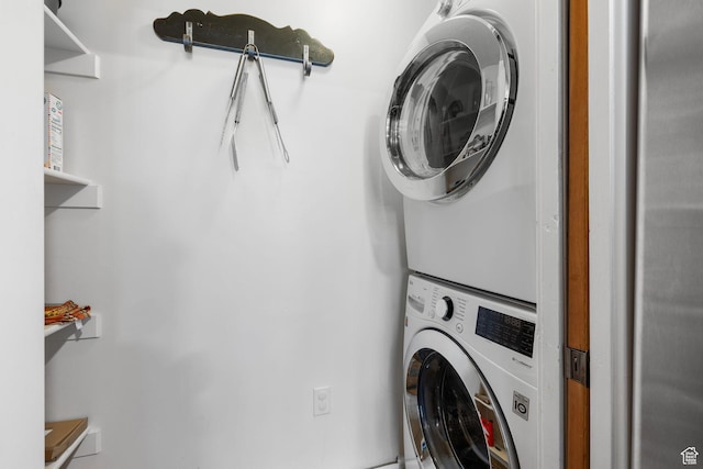 6785 N 2200 W Unit 207, Park City, UT 84098 - laundry room featuring stacked washer / dryer