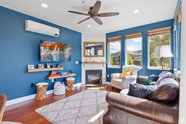 6785 N 2200 W Unit 207, Park City, UT 84098 - living area featuring an AC wall unit, a glass covered fireplace, recessed lighting, wood finished floors, and a ceiling fan