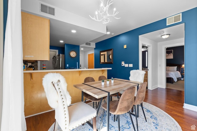 6785 N 2200 W Unit 207, Park City, UT 84098 - dining area with wood finished floors, a chandelier, and recessed lighting