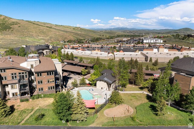 6785 N 2200 W Unit 207, Park City, UT 84098 - aerial perspective of suburban area featuring a mountain backdrop and a pool area