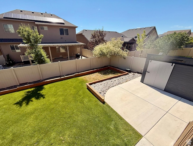 12887 S Wild Mare Way, Riverton, UT 84096 - fenced backyard with a patio area, a residential view, and a vegetable garden