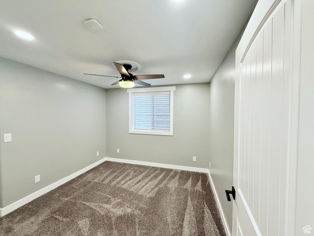 12887 S Wild Mare Way, Riverton, UT 84096 - spare room featuring a ceiling fan and dark carpet