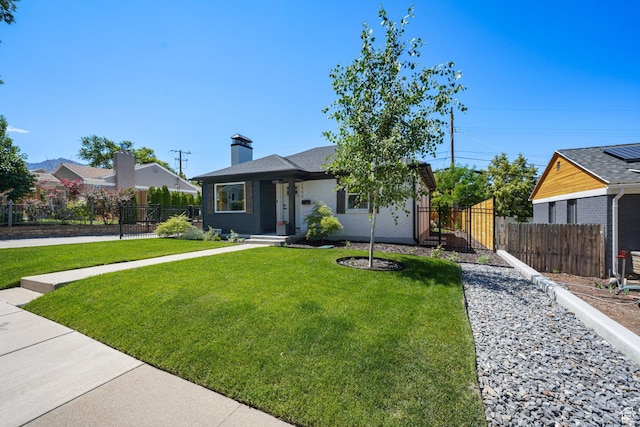 2500 E Simpson Ave S, Salt Lake City, UT 84109 - view of front facade featuring a chimney