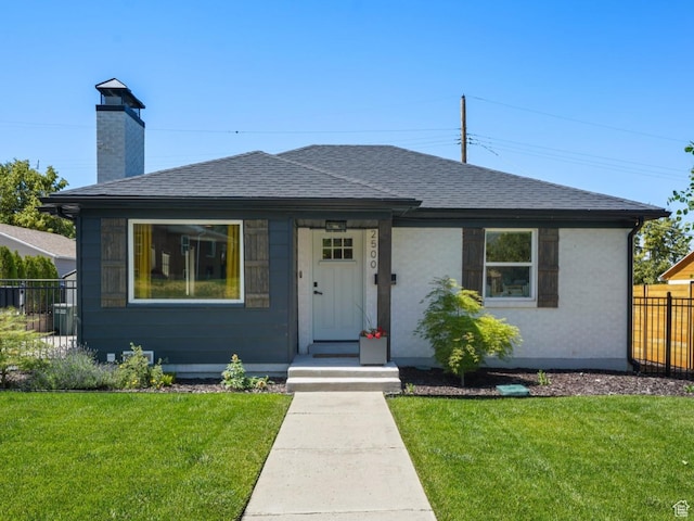 2500 E Simpson Ave S, Salt Lake City, UT 84109 - bungalow featuring roof with shingles and a chimney