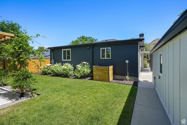 2500 E Simpson Ave S, Salt Lake City, UT 84109 - rear view of house with a chimney