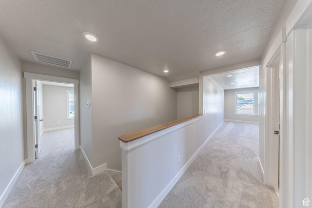 2864 N 3475 W, Plain City, UT 84404 - corridor with carpet floors, a textured ceiling, an upstairs landing, and recessed lighting