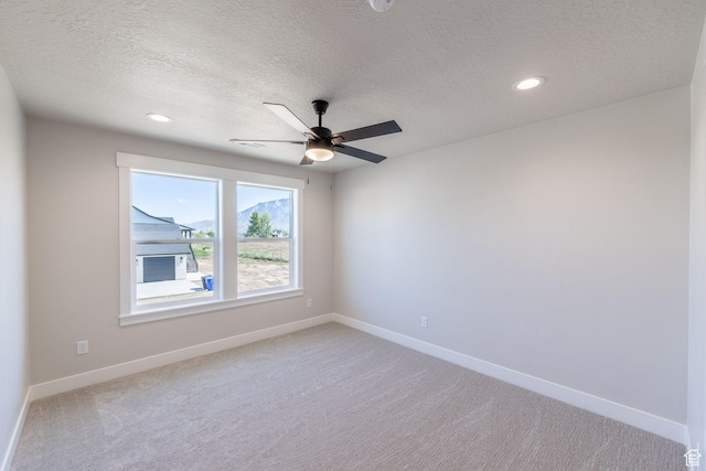 2864 N 3475 W, Plain City, UT 84404 - empty room with light carpet, a textured ceiling, a ceiling fan, and recessed lighting