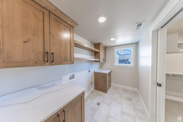 2864 N 3475 W, Plain City, UT 84404 - laundry area with cabinet space, hookup for an electric dryer, hookup for a washing machine, and a textured ceiling
