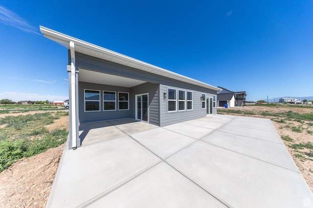 2864 N 3475 W, Plain City, UT 84404 - rear view of house with a patio