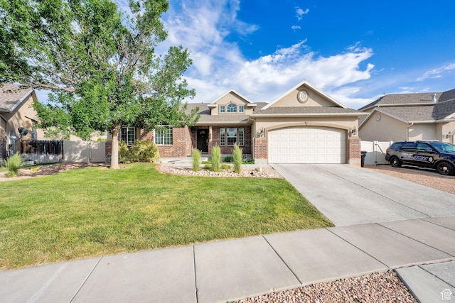 356 Warley Way, Stansbury Park, UT 84074 - view of front facade featuring brick siding, an attached garage, concrete driveway, and stucco siding