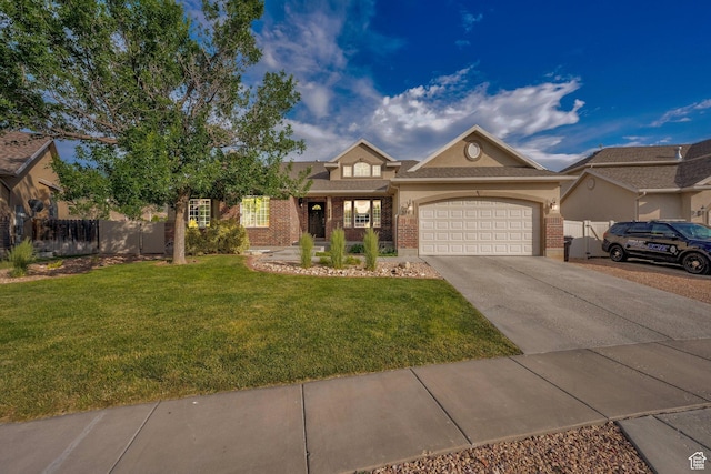 356 Warley Way, Stansbury Park, UT 84074 - view of front of property with brick siding, driveway, and an attached garage