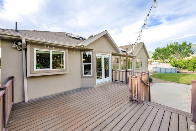 356 Warley Way, Stansbury Park, UT 84074 - wooden terrace with french doors and an outdoor pool