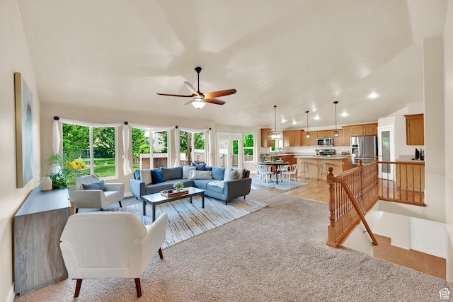 356 Warley Way, Stansbury Park, UT 84074 - living room featuring ceiling fan and light colored carpet