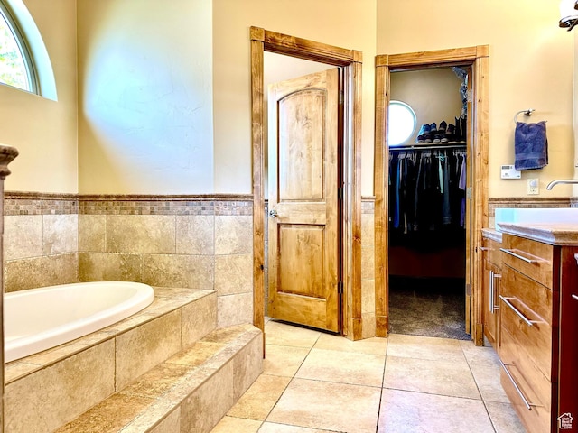620 S Michael St, Vernal, UT 84078 - full bathroom with a garden tub, vanity, a spacious closet, and tile patterned flooring