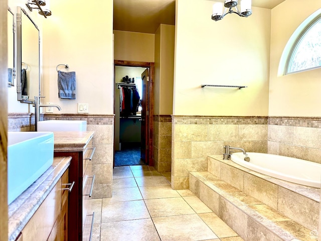 620 S Michael St, Vernal, UT 84078 - bathroom featuring vanity, a garden tub, a walk in closet, a wainscoted wall, and a chandelier