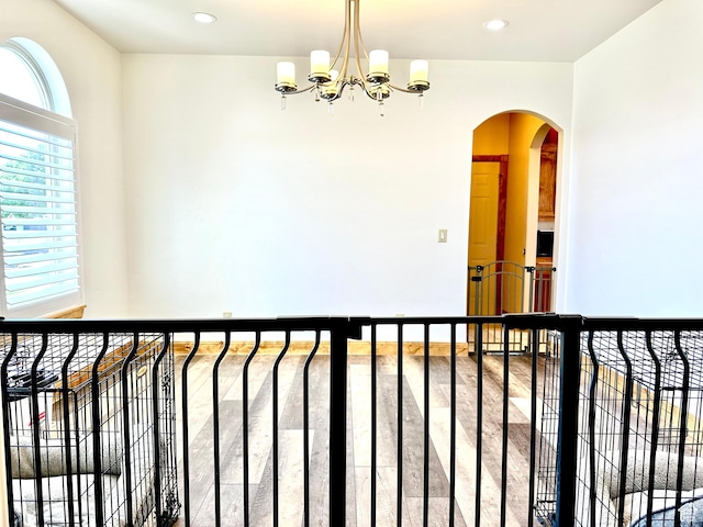 620 S Michael St, Vernal, UT 84078 - interior space with arched walkways, a chandelier, recessed lighting, and wood finished floors