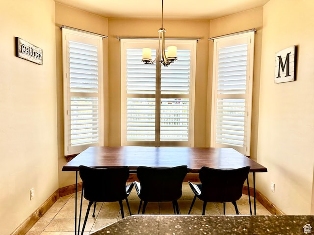 620 S Michael St, Vernal, UT 84078 - tiled dining room featuring a chandelier and baseboards