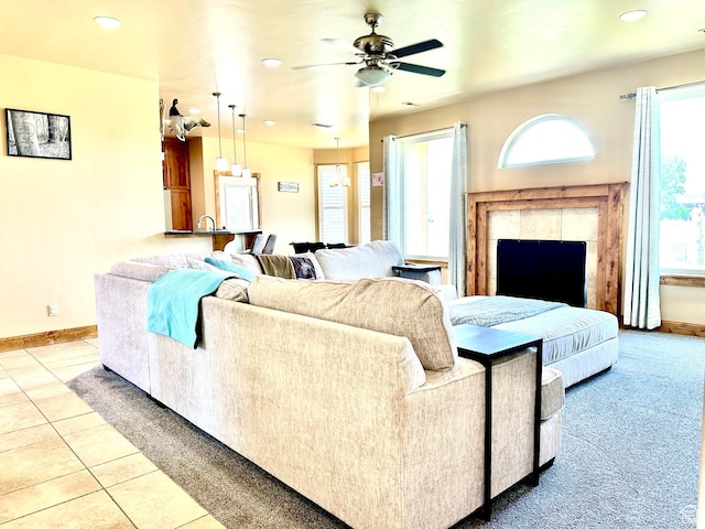 620 S Michael St, Vernal, UT 84078 - living room with healthy amount of natural light, light tile patterned flooring, a ceiling fan, recessed lighting, and a fireplace