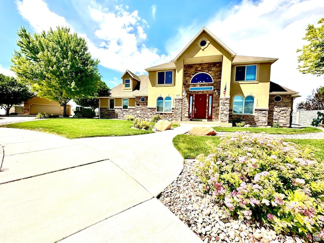 620 S Michael St, Vernal, UT 84078 - view of front of home featuring stone siding, stucco siding, and a front lawn