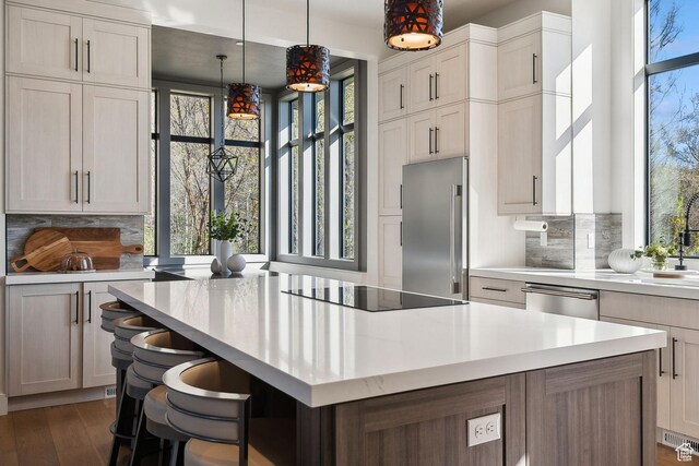 8960 Parleys Ln, Park City, UT 84098 - kitchen featuring stainless steel appliances, light countertops, healthy amount of natural light, and a kitchen island