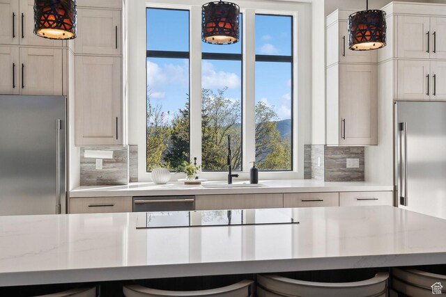 8960 Parleys Ln, Park City, UT 84098 - kitchen featuring stainless steel fridge, stainless steel built in refrigerator, decorative backsplash, and hanging light fixtures