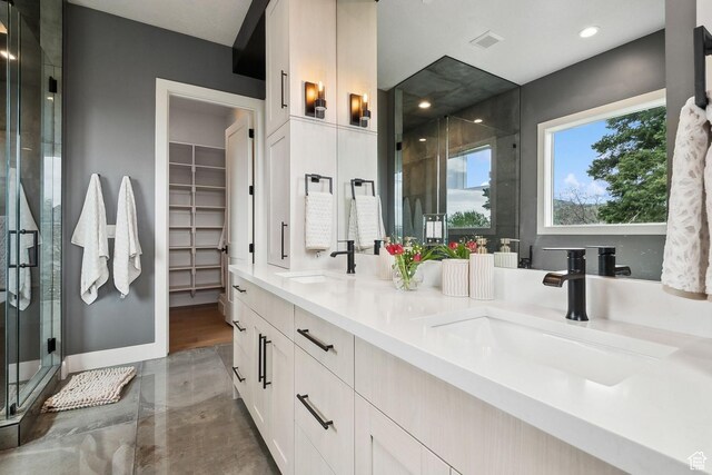 8960 Parleys Ln, Park City, UT 84098 - full bathroom with a stall shower, double vanity, recessed lighting, and a walk in closet