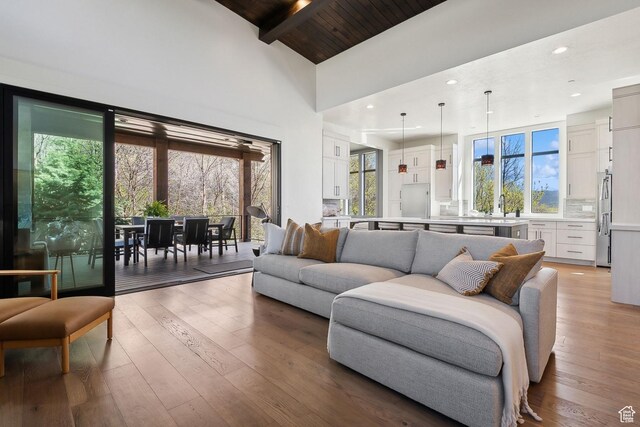 8960 Parleys Ln, Park City, UT 84098 - living room featuring light wood-style flooring, high vaulted ceiling, a wood ceiling with exposed beams, and recessed lighting
