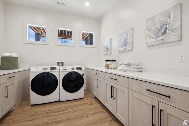 8960 Parleys Ln, Park City, UT 84098 - laundry area with washing machine and clothes dryer, cabinet space, light wood-style floors, and recessed lighting