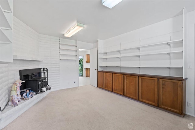 220 S Coleman St W, Tooele, UT 84074 - living area with carpet floors and a wood stove
