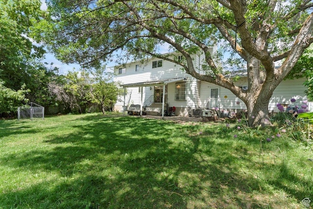220 S Coleman St W, Tooele, UT 84074 - rear view of house with a yard