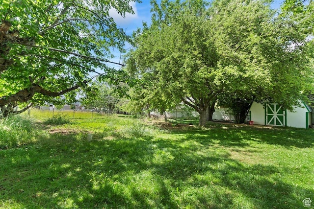 220 S Coleman St W, Tooele, UT 84074 - view of green lawn featuring an outdoor structure and a barn