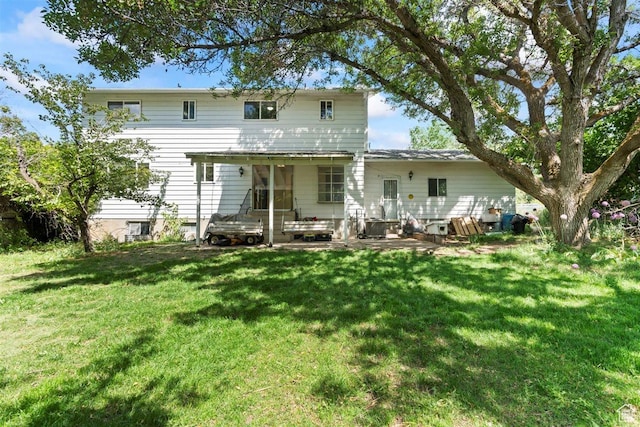 220 S Coleman St W, Tooele, UT 84074 - back of property featuring a yard and a patio area