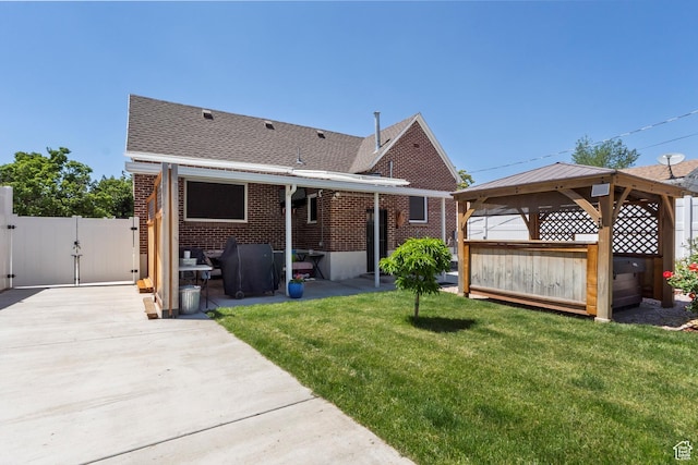 3530 Madison Ave, Ogden, UT 84403 - rear view of house featuring a gazebo, a gate, a patio, and brick siding