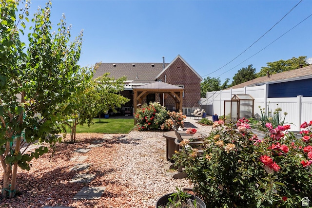 3530 Madison Ave, Ogden, UT 84403 - back of house featuring a gazebo, an exterior structure, a patio, an outdoor structure, and brick siding