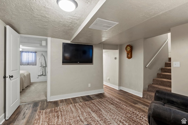 3530 Madison Ave, Ogden, UT 84403 - living area featuring wood finished floors, a textured ceiling, and stairs