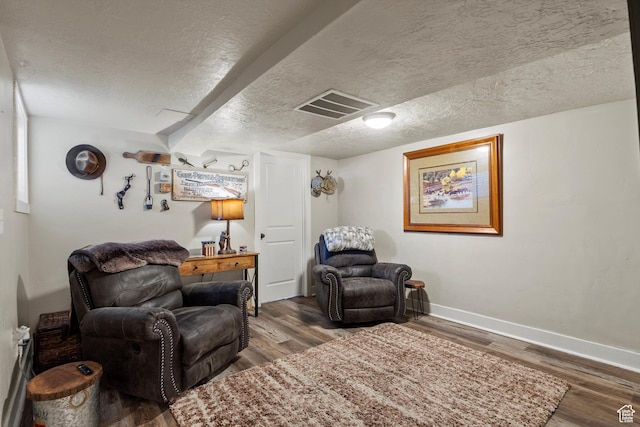 3530 Madison Ave, Ogden, UT 84403 - sitting room featuring a textured ceiling and wood finished floors
