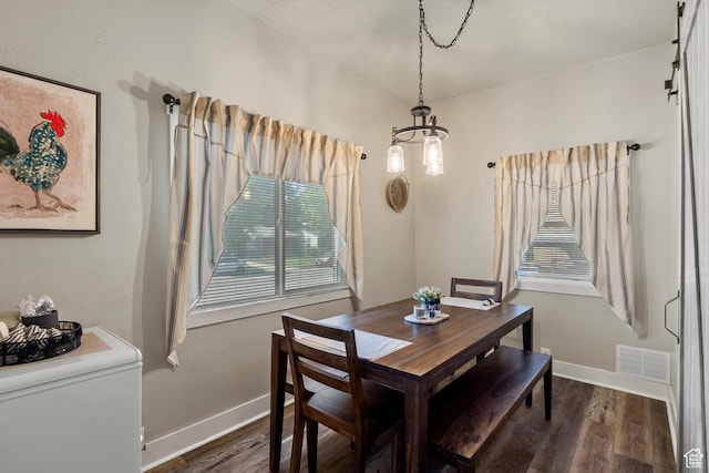 3530 Madison Ave, Ogden, UT 84403 - dining space featuring dark wood-style floors and a chandelier