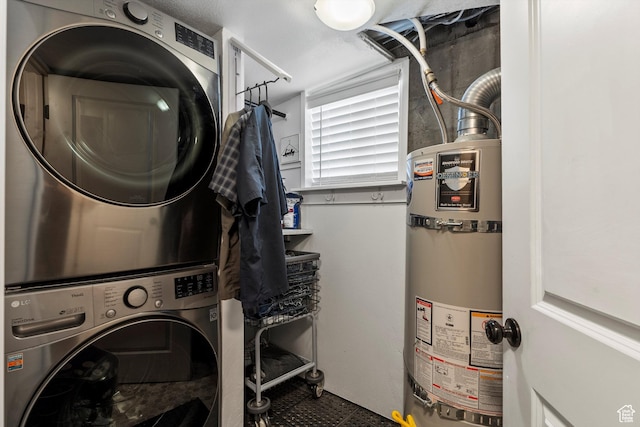 3530 Madison Ave, Ogden, UT 84403 - washroom with secured water heater and stacked washer / dryer