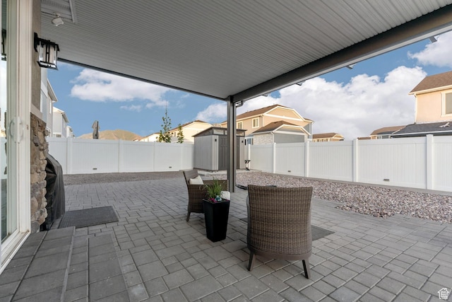743 W 950 S, Springville, UT 84663 - fenced backyard featuring a storage shed, a patio area, and a residential view